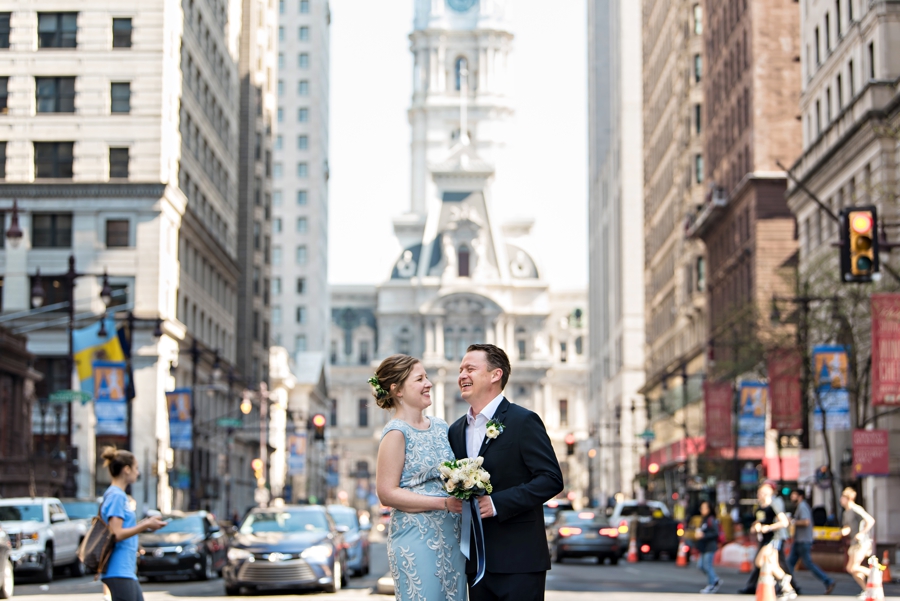 A bride and groom have their first look in the middle of broad street in Philadelphia before the ceremony.